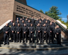The 24 graduates of the Appalachian Police Academy’s sixth class are pictured with App State Director of Public Safety and Chief of Police Andy Stephenson, far left in second row, App State Police Capt. K.C. Mitchell, far left in first row, and App State Police Officer Tina Dunn, far right in first row, on the steps of App State’s Rosen Concert Hall. From left to right, top row to bottom row, are April Gunter, Drew Van Hise, Jonathan Flores, Jacob Lowe, Timothy Fitzgerald, Isaac Holliday, Anderson Ray, Blai